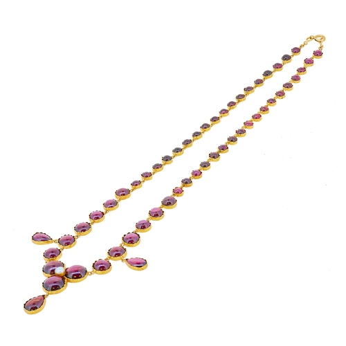 103 - ANTIQUE PEARL AND GARNET DROP NECKLACE, in 15 ct. gold. Each link set with a cabochon cut garnet in ... 