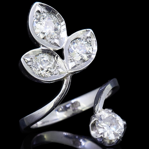 21 - DIAMOND FLORAL TWIST RING, the floral trefoil shaped top set with 3 diamonds, and a single diamond t... 