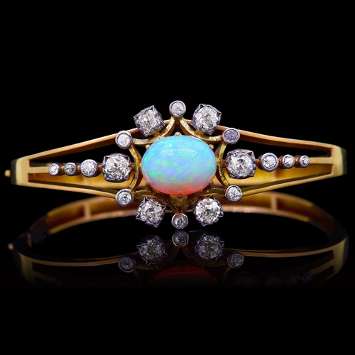 26 - IMPORTANT OPAL AND DIAMOND BINGED BANGLE, set to the center of the top with a cabochon cut oval opal... 
