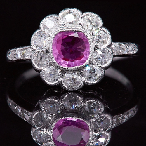 28 - ANTIQUE PINK SAPPHIRE AND DIAMOND CLUSTER RING, set with a central pink sapphire of approx. 0.68 ct.... 