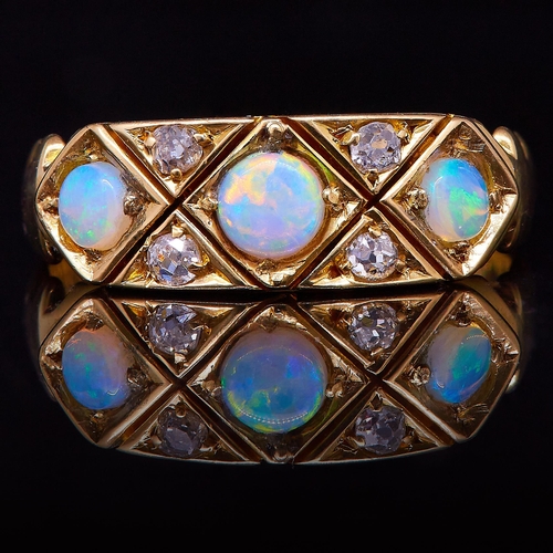 30 - ANTIQUE OPAL AND DIAMOND DRESS RING, set with 3 opals, flanked with 4 diamonds. Inside with text and... 