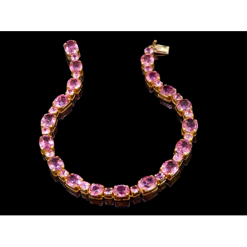8 - SPINEL AND PINK SAPPHIRE LINE BRACELET, the larger spinel stones alternated with smaller pink sapphi... 