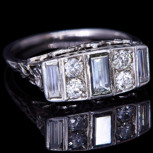 10 - DIAMOND DRESS RING, se with 3 baguette cut diamonds and 4 brilliant cut diamonds, totalling approx. ... 