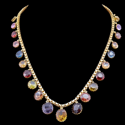 12 - MULTI-GEMSTONE DROP NECKLACE, in 18 ct. gold. The necklace set with 21 multi gemstone drops, graduat... 