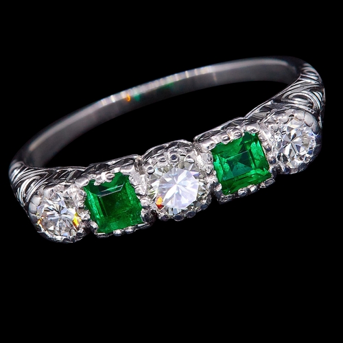 22 - EMERALD AND DIAMOND 5-STONE RING, in platinum. Set with 2 emeralds, totalling approx. 0.35 ct. flank... 