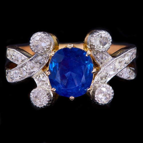 32 - SAPPHIRE AND DIAMOND DRESS RING, set with a central blue sapphire of approx. 1.22 ct. Flanked with d... 