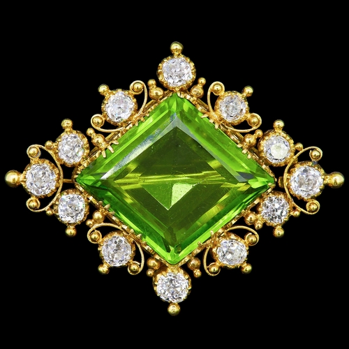 34 - ANTIQUE VICTORIAN PERIDOT AND DIAMOND BROOCH, set with a central diamond cut peridot of approx. 19 c... 