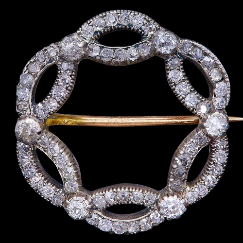 39 - ANTIQUE VICTORIAN DIAMOND BROOCH, of circular design as 2 entwined rows. Set throughout with diamond... 