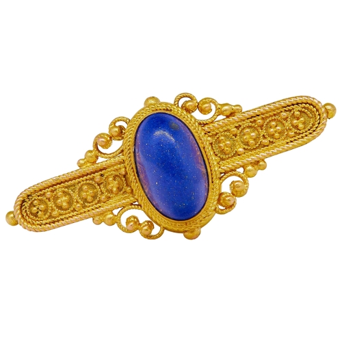 40 - ANTIQUE REVIVAL LAPISLAZULI BROOCH, in 18 ct. gold. Set with a central oval cabochon cut lapis lazul... 