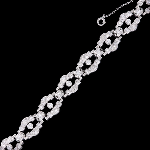 42 - ART-DECO DIAMOND OPENWORK LINK BRACELET, set with diamonds totalling approx 1.90 ct. L. 16.5 cm. 25.... 