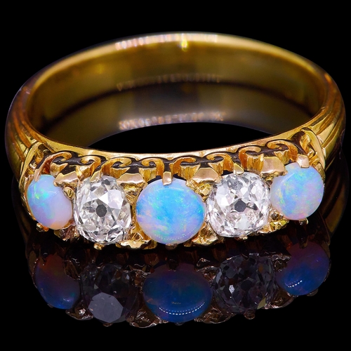 47 - OPAL AND DIAMOND 5-STONE DRESS RING, set with 3 round cabochon cut opals, flanked with 2 ld cut diam... 