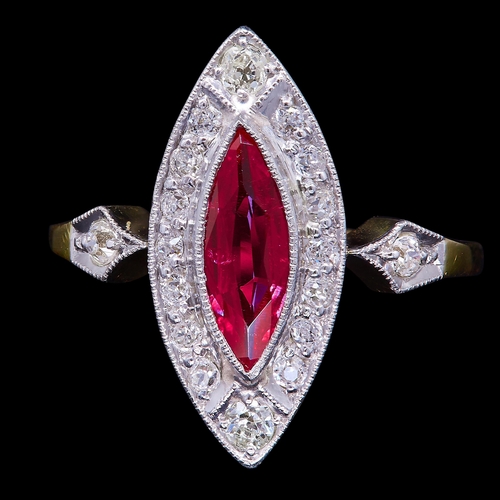51 - RUBY AND DIAMOND CLUSTER RING, of marquise shape, set with a central marquise shaped ruby of approx.... 
