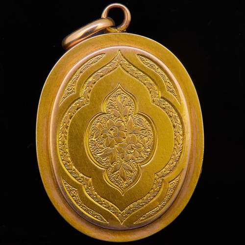 59 - ANTIQUE VICTORIAN LOCKET PENDANT, deocrated with engraved floral design to the front and back. The i... 
