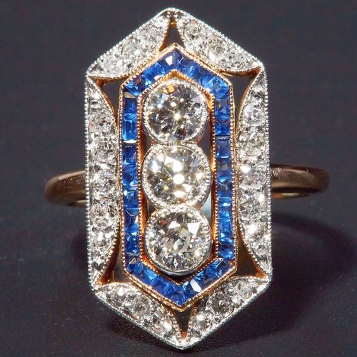 27 - SAPPHIRE AND DIAMOND DRESS RING, in 14 ct. gold. The ring od elongated hexagonal design, set with 3 ... 
