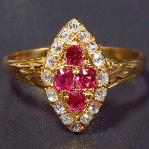 29 - RUBY AND DIAMOND DRESS RING, set wiith 4 rubies to the center totalling approx. 0.24 ct. flanked wit... 