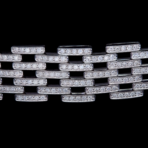 44 - A SPECTACULAR PAVÉ SET DIAMOND BRACELET, of articulated pavé set dimaond brick link design, Diamonds... 