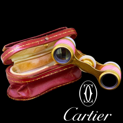 54 - CARTIER, RARE PAIR OF ENAMEL OPERA GLASSES, The barrels decorated with pink enamel and with gold scr... 