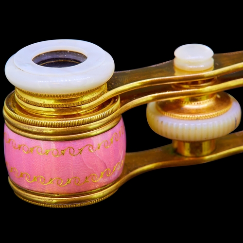 54 - CARTIER, RARE PAIR OF ENAMEL OPERA GLASSES, The barrels decorated with pink enamel and with gold scr... 