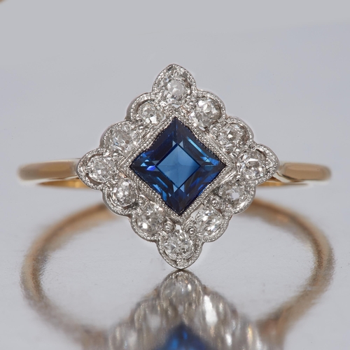 122 - SAPPHIRE AND DIAMOND RING, of square design, set with a central blue sapphire of approx. 0.55 ct. Fl... 