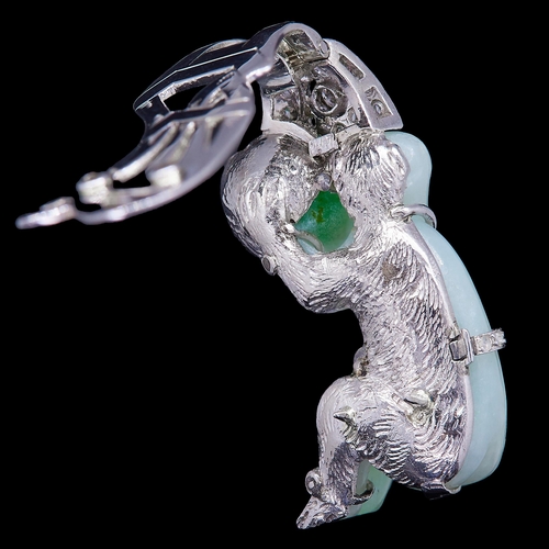 57 - JADE AND DIAMOND CLIP BROOCH, the carved jade in the shape of a sitting monkey, holding a peach. Wit... 