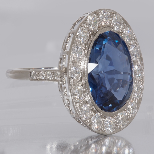 120 - IMPORTANT CERTIFICATED 14.80 CT. CEYLON NO HEAT BLUE SAPPHIRE AND DIAMOND RING, set to the center wi... 