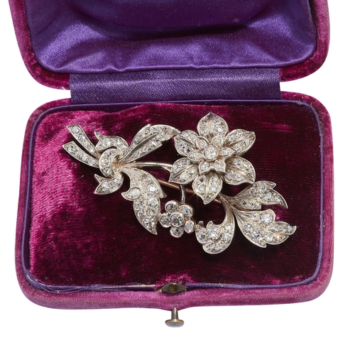 133 - DIAMOND EN TREMBLANT FLORAL SPRAY BROOCH, set throughout with diamonds on the leaves, flowers and st... 