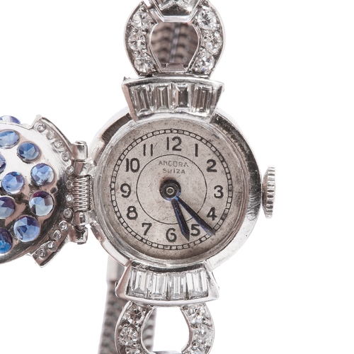 174 - SAPPHIRE AND DIAMOND BRACELET WATCH, the cover of the dial set with blue sapphires totalling approx.... 