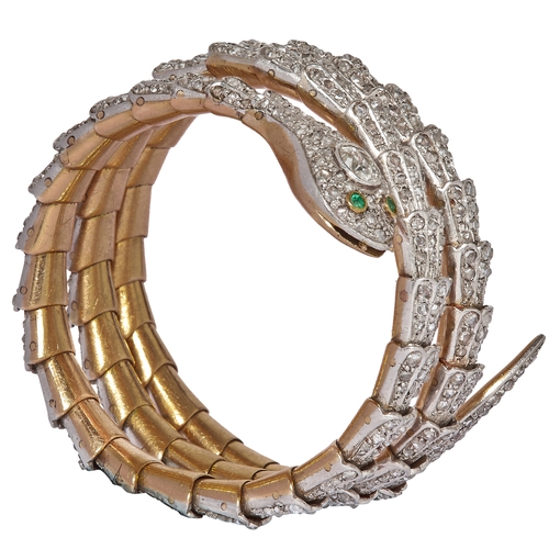 209 - IMPORTANT DIAMOND SPRING SNAKE BANGLE. The spring bangle designed as a snake, of 3 coil design. Each... 