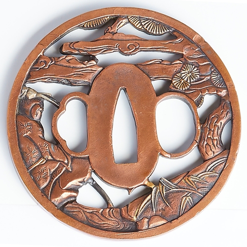 231 - TSUBA, of openwork design, depicting in relief a fisher man in landscape. Signed. Diam. 8 cm. Japan