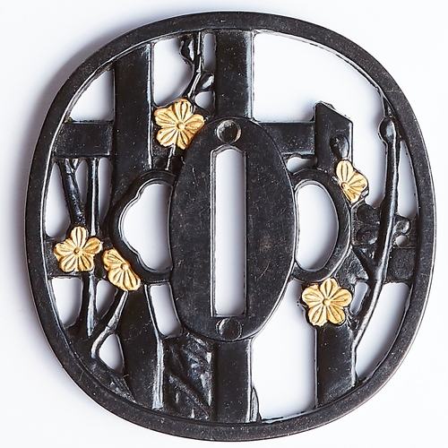 232 - TSUBA, of openwork design, depicting floral design and bamboo. Diam. 7.3 cm. Japan.