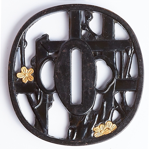 232 - TSUBA, of openwork design, depicting floral design and bamboo. Diam. 7.3 cm. Japan.