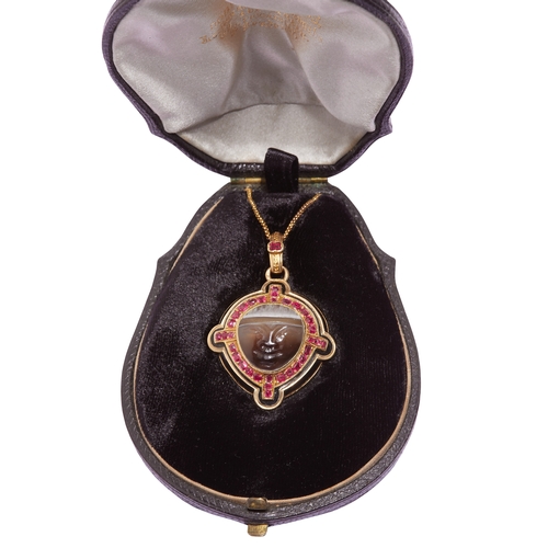 59 - ANTIQUE RUBY, ENAMEL AND CARVED FACE LOCKET PENDANT, in 18 ct. gold. The pendant set with an intagli... 