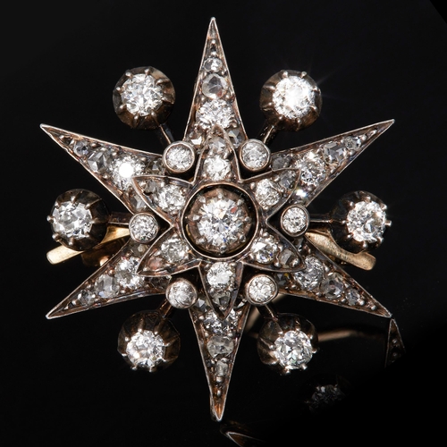 118 - ANTIQUE DIAMOND STAR BROOCH, Set with a central diamond cluster, flanked with diamonds on the sprays... 