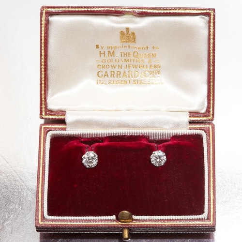 202 - DIAMOND STUD EARRINGS. set with two diamonds totalling approx 1.10ct. 1.7 grams.