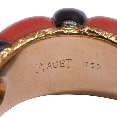 286 - PIAGET, CORAL AND ONYX RING, in 18 ct. gold. The 2 carved coral sections accentuated with an onyx. T... 