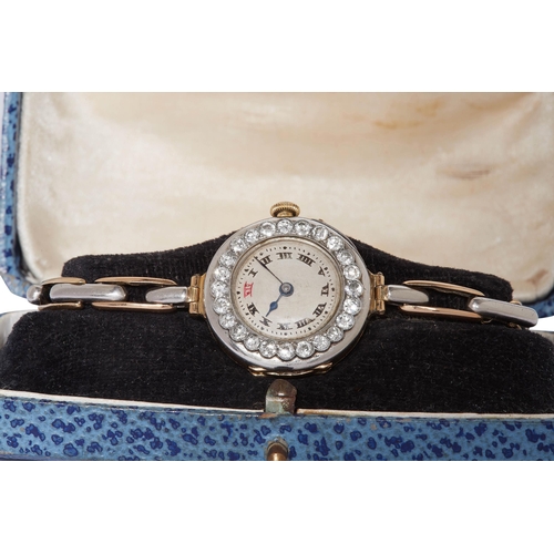 386 - LADIES DIAMOND WRIST WATCH, The silver colored dial with Roman numerals. Manual winding. The bezel s... 