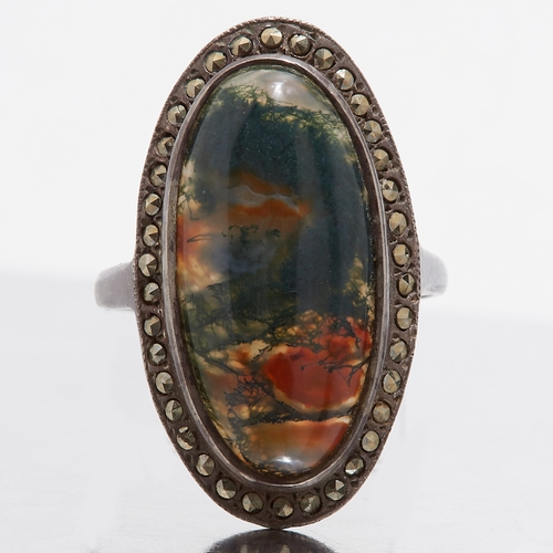 115 - CABOCHON QUARTZ RING, set with a cabochon surrounded with marcasite. Size N. 6.8 grams.