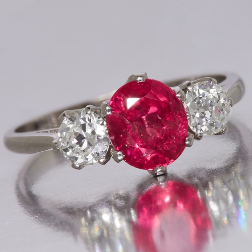 3 - CERTIFICATED BURMA RUBY AND DIAMOND 3-STONE RING, in 18 ct. gold. Set with a central ruby of approx.... 