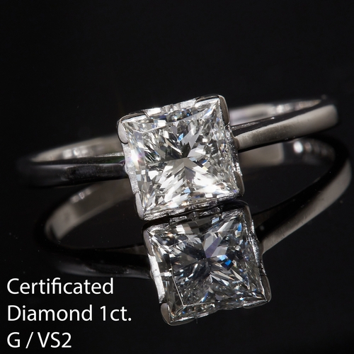 8 - CERTIFIED DIAMOND SOLITAIRE RING, set with a princess cut diamond of 1.00 ct. size M 1/2. 2.6 grams.... 