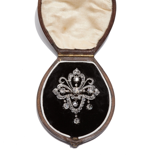 95 - VICTORIA DIAMOND DROP BROOCH, of openwork, part scrolling design. Set with diamonds totalling approx... 