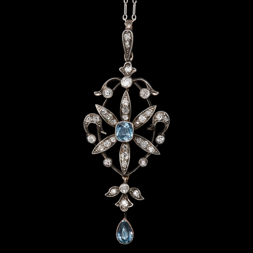 23 - EDWARDIAN SCROLL PENDANT WITH AQUAMARINE AND DIAMOND. set with with a aquamarine in the center surro... 
