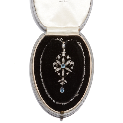 23 - EDWARDIAN SCROLL PENDANT WITH AQUAMARINE AND DIAMOND. set with with a aquamarine in the center surro... 