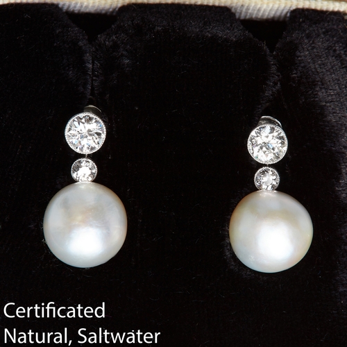 53 - IMPORTANT PAIR OF NATURAL SALTWATER PEARL AND DIAMOND DROP EARRINGS, The diamond tops suspending a l... 