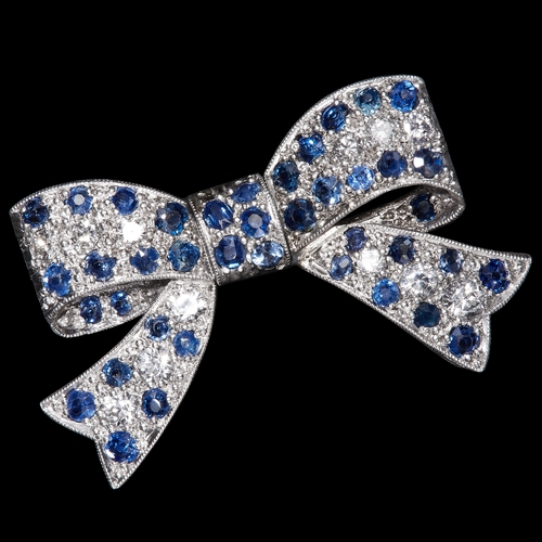 1 - EDWARDIAN SAPPHIRE AND DIAMOND BOW BROOCH, Set with vibrant sapphires and bright and lively diamonds... 