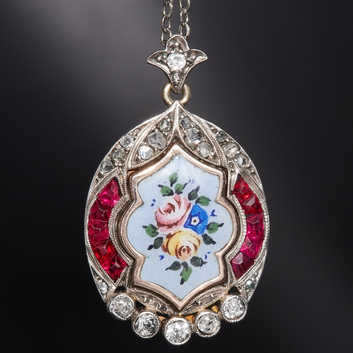 121 - FINE ENAMEL RUBY AND DIAMOND LOCKET PENDANT.  locket pendant with enamelled flower design to the cen... 