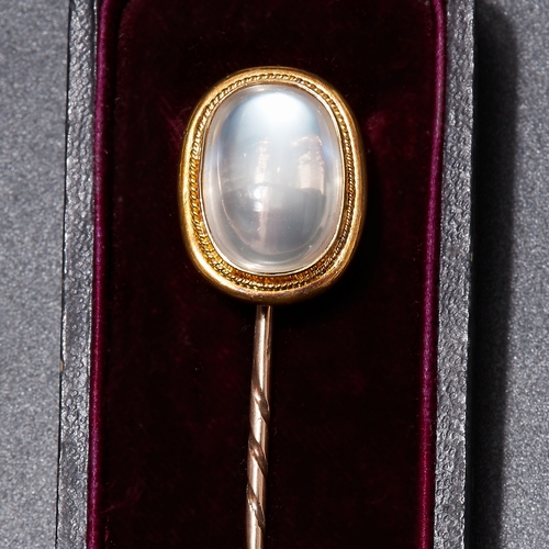 122 - VICTORIAN MOONSTONE STICK PIN. testing as gold. set with a large vibrant moonstone , with rope twist... 
