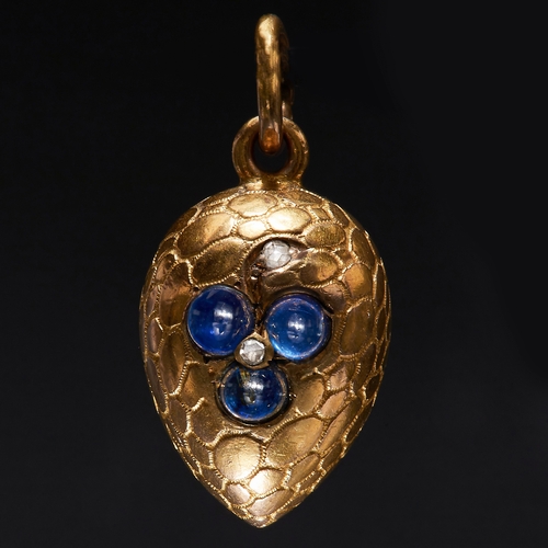 135 - SAPPHIRE AND DIAMOND EGG PENDANT, the egg of textured shell design, decorated with a flower set with... 
