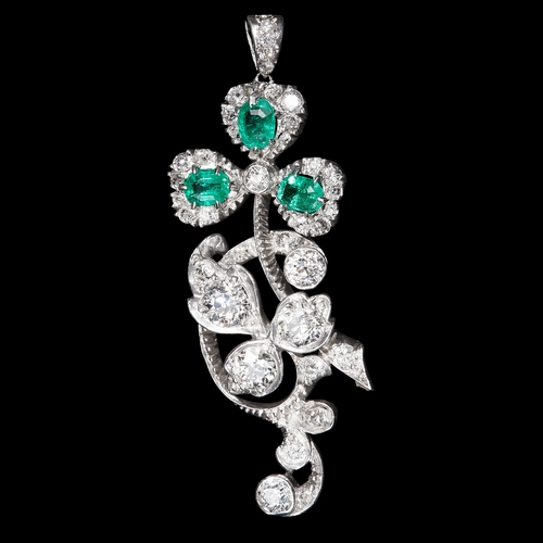 136 - IMPRESSIVE DIAMOND AND EMERALD FLORAL PENDANT. set with bright lively diamonds totalling approx 1.10... 