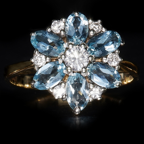 139 - AQUAMARINE AND DIAMOND CLUSTER RING, in 9 ct. gold. Size M 1/2. 3 grams.
