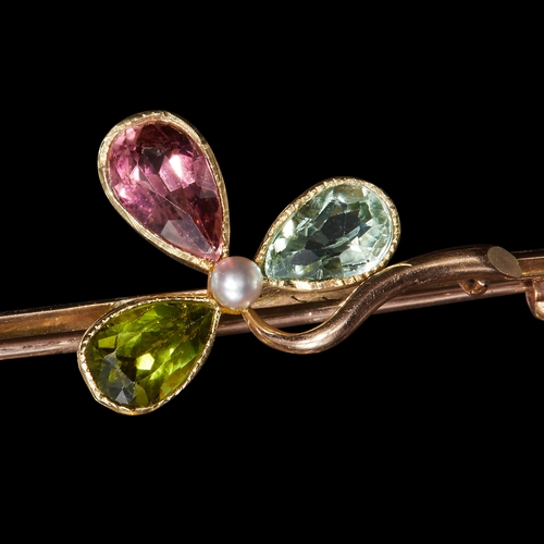 149 - EDWARDIAN SHAMROCK LEAF BROOCH, set with gemstones including tourmaline. W. 4.1 cm. 3.3 grams.